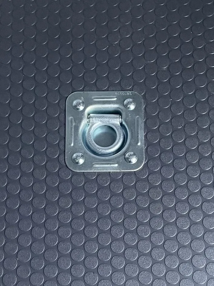 Recessed floor tie-down installed in a trailer